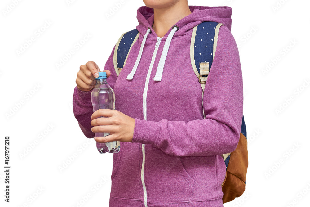 Girl with a backpack on her shoulders and water in her hands. isolated on white background Girl with a backpack on her shoulders and water in her hands. isolated on white background