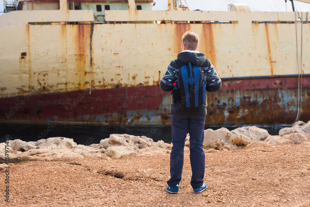 Man traveler with backpack enjoying the natural surroundings. Man traveler with backpack enjoying the natural surroundings.