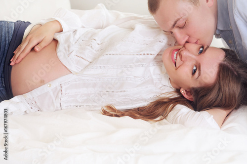 Family couple enjoys a peacefull moment waiting for a baby