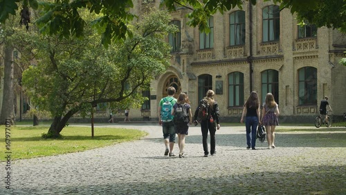 Students life, young men and women walking on university campus, education
