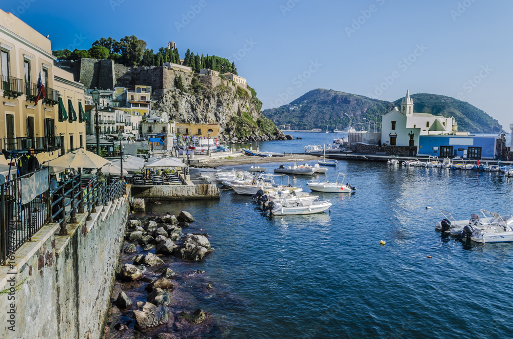 Buildings surrounding the marina and old fortress on the island of Lipari