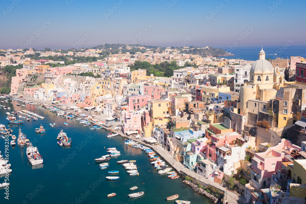 Procida island colorful town with harbor aerial view, Italy