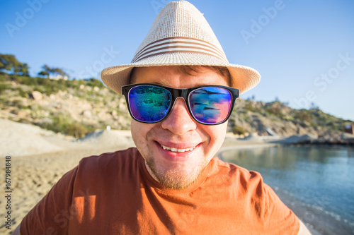 Man in sunglasses in seashore