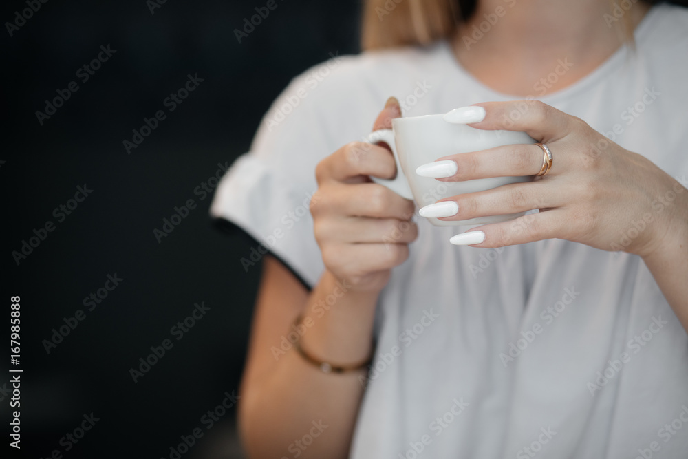 Young Happy Woman Drinking Green Tea in a cafe Young Happy Woman Drinking Green Tea in a cafe