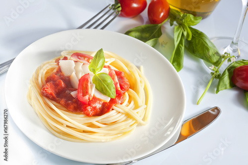 Spaghetti with tomato sauce and parmesan