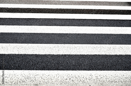 pedestrian stripes close up in front of photo