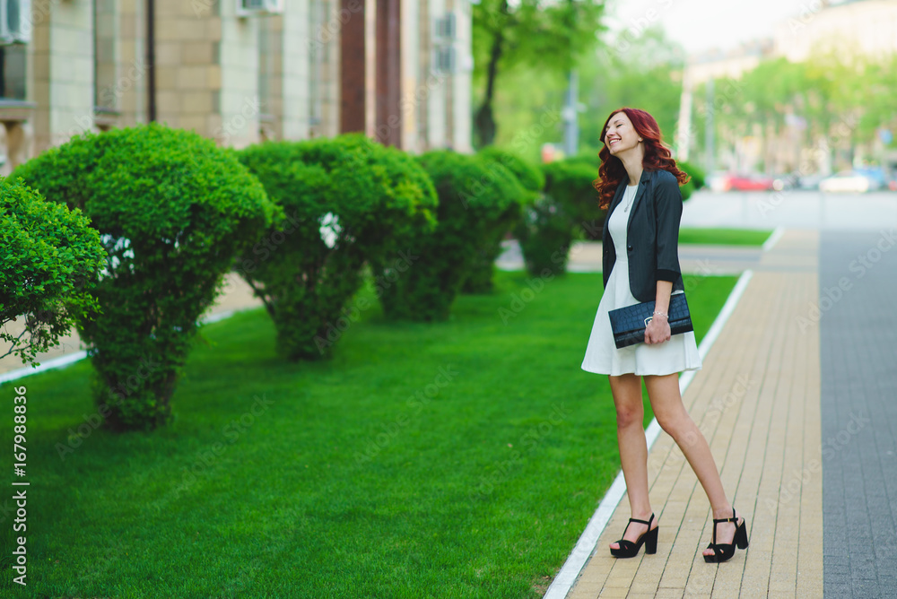 Business woman walking through the city Business woman walking through the city