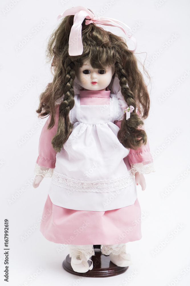 Ceramic porcelain handmade brunette doll with pigtails in pink dress