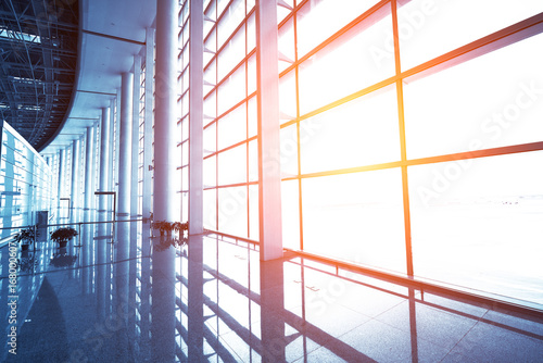 Canvas Print modern airport scene of passenger motion blur with window outside