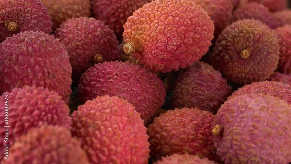 Lychees (rotating on a wooden plate; seamless loopable; 4K) Lychees (rotating on a wooden plate; seamless loopable; 4K)