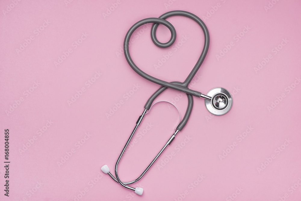 Medical concept. The stethoscope with heart shape on pink background. Medical concept. The stethoscope with heart shape on pink background.