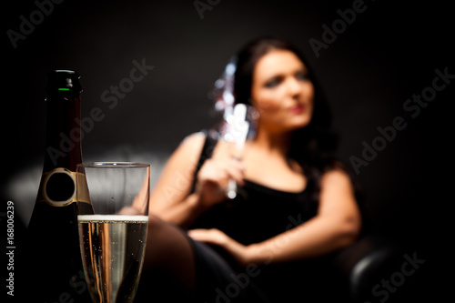 Young Woman Enjoying A Glass Of Champagne