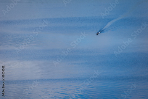 A man riding the boat in the lake