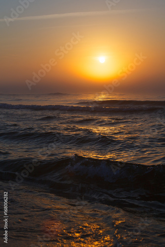 Beatiful red sunset over sea surface