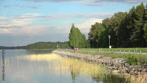 View on road by lake Tuunaansalmi, june evening. Finland photo