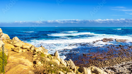 Waves of the Atlantic Ocean breaking on the rocky shores of Cape of Good Hope in Cape Point Nature Reserve on the Cape Peninsula in South Africa © hpbfotos