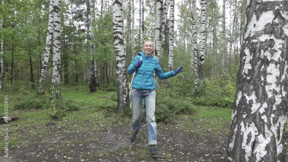 young woman with a long fair hair runs in the birch wood,slow motion young woman with a long fair hair runs in the birch wood,slow motion