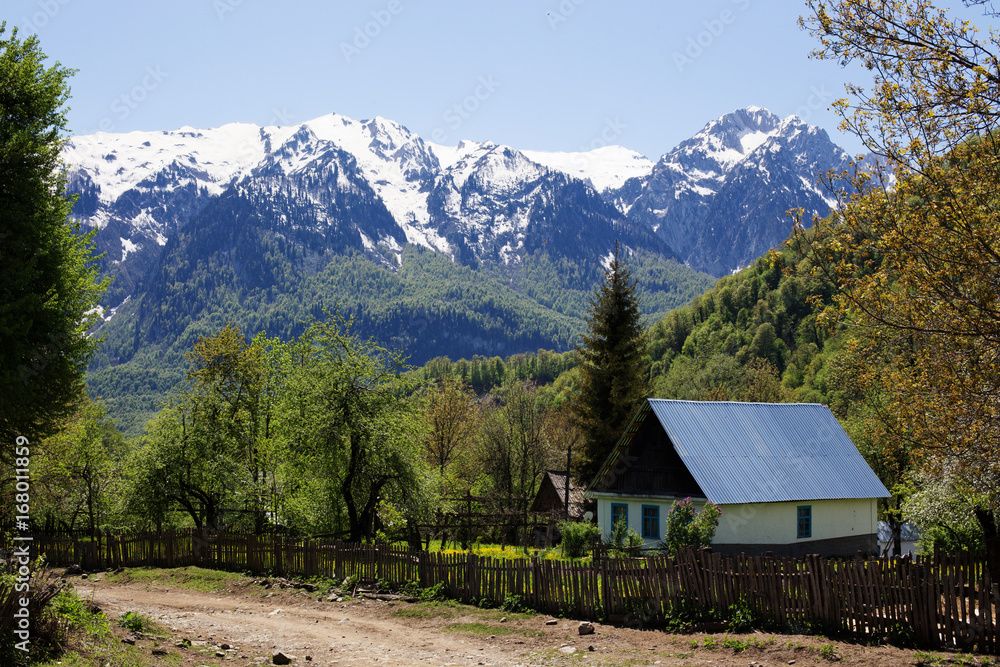 Mountainous landscape in the spring, an alpine village in a valley.