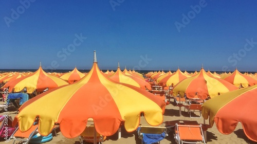 distesa di ombrelloni sulla costa romagnola photo