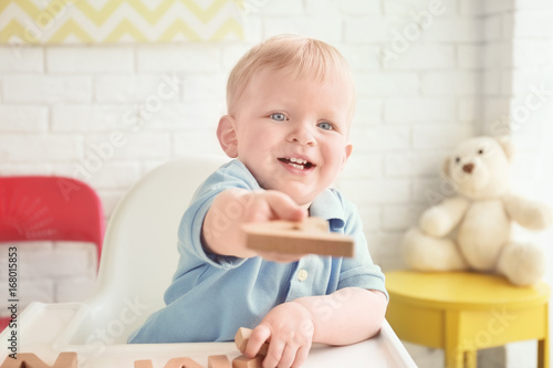 Cute little boy playing wit...