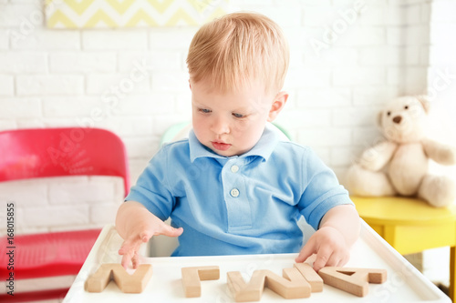 Cute little boy playing wit...