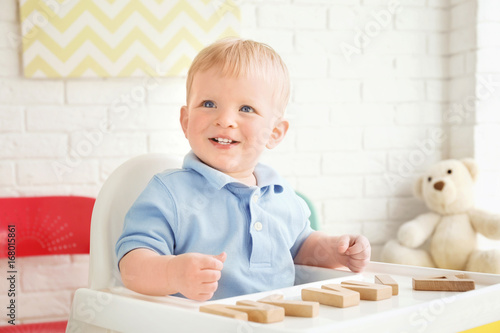 Cute little boy playing wit...