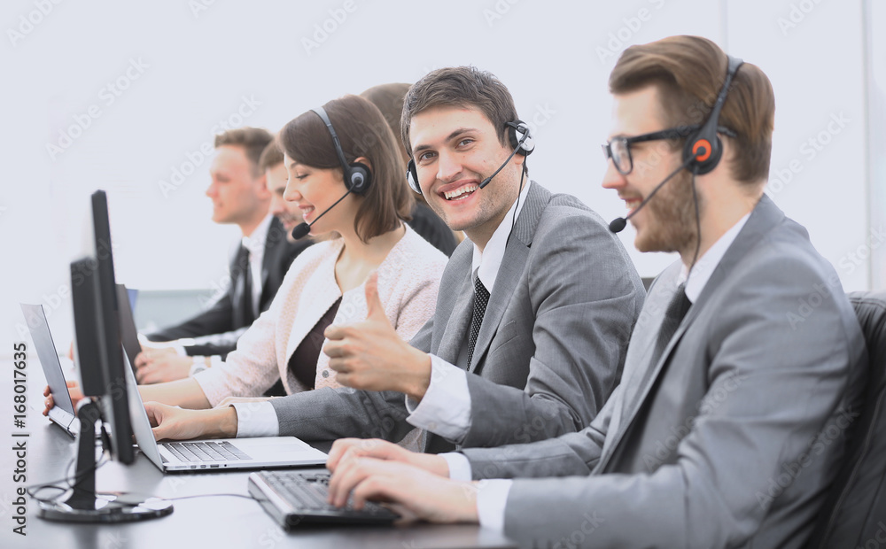 employee call center with headset showing thumb up employee call center with headset showing thumb up