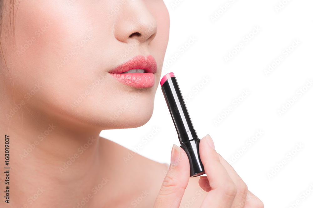 Pretty face beauty lady applying lipstick. Beautiful girl makes makeup