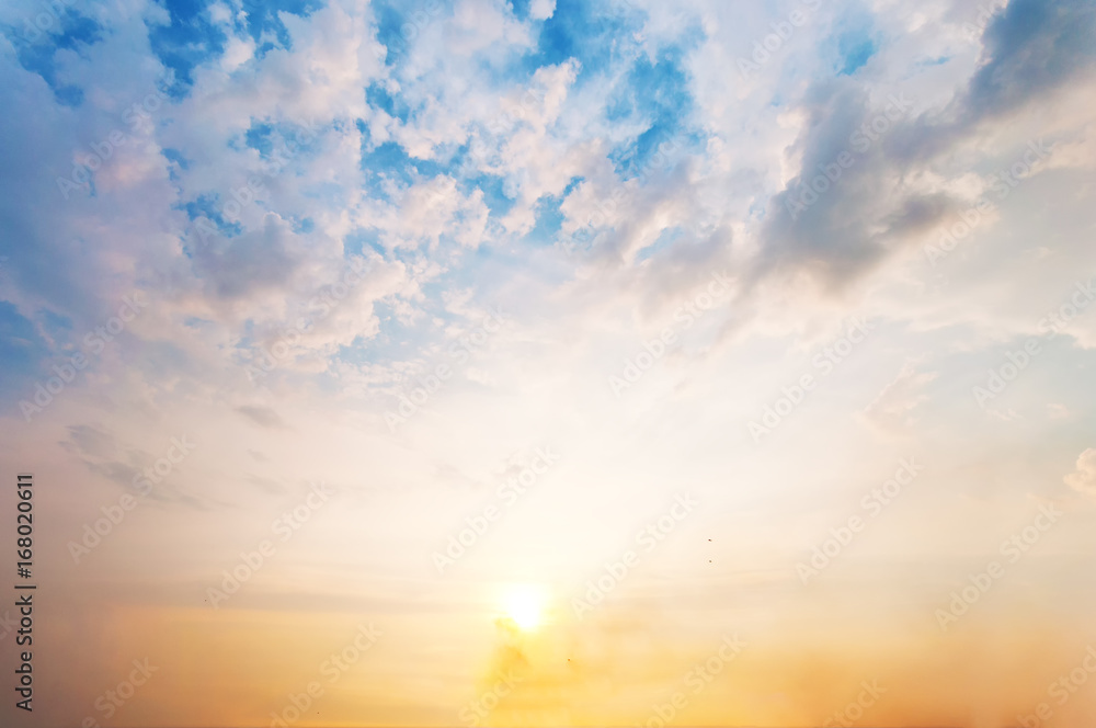 Sky background at sunset,Sky blue and orange light of the sun through the  clouds in the sky Stock Photo | Adobe Stock