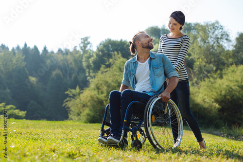 Фотография Man with disabilities and his wife exchanging loving looks