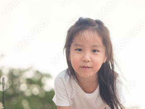 adorable Asian cute girl close up head shot   healthy girl  funny action  wear a white t shirt