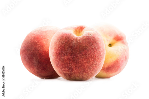 close up view of fresh and ripe peaches isolated on white