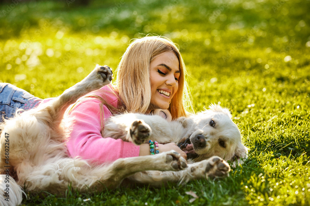 Woman is relaxing with dog