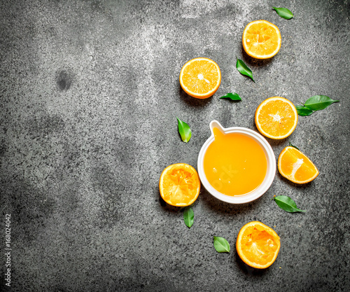 Fototapeta Naklejka Na Ścianę i Meble -  Freshly squeezed orange juice with pieces of fruit .