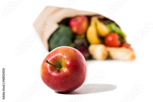 ripe apple and grocery bag