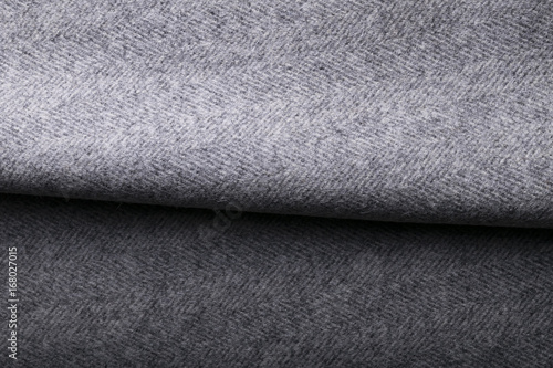  tweed fabric, wool gray herringbone textile background.