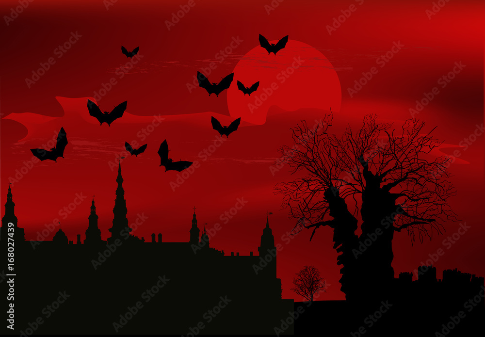 black castle and bats at red sunset