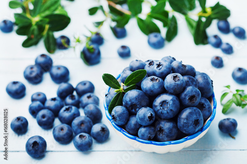 Wallpaper Mural Blueberry or great bilberry in bowl on blue vintage table. Organic superfood and healthy nutrition. Torontodigital.ca