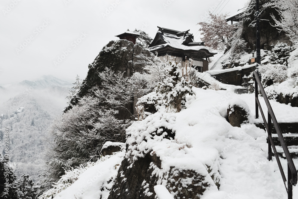 Snow falling at yamadera shrine in japan winter Snow falling at yamadera shrine in japan winter