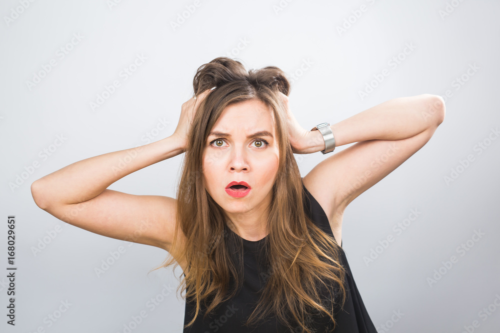 Portrait of a stressed woman holding head in hands Portrait of a stressed woman holding head in hands