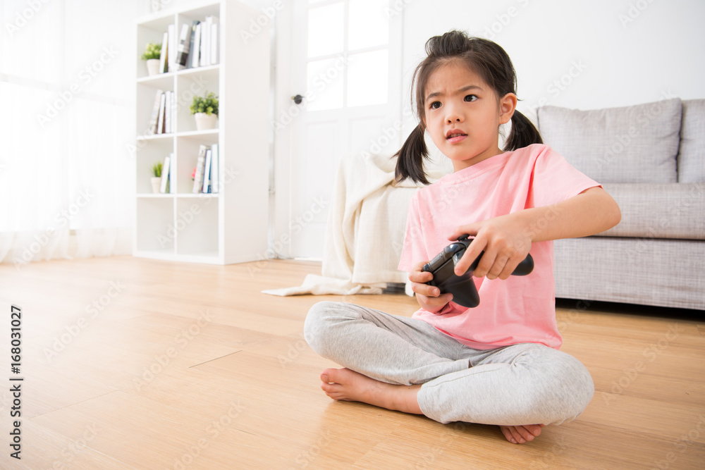kid girl children using control joystick seriously kid girl children using control joystick seriously