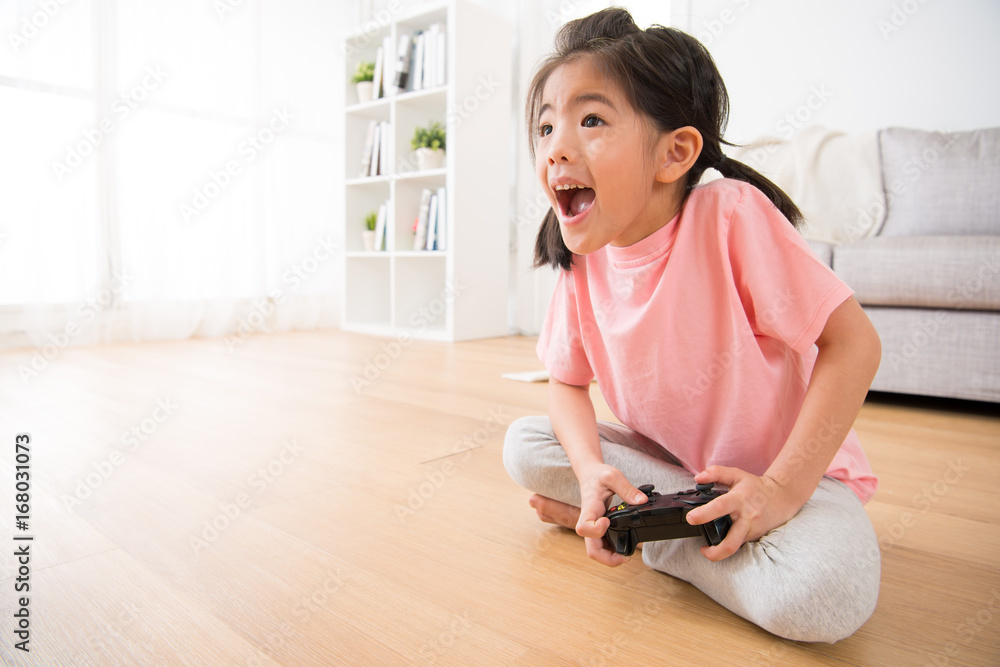 little girl holding joystick happy play video game little girl holding joystick happy play video game