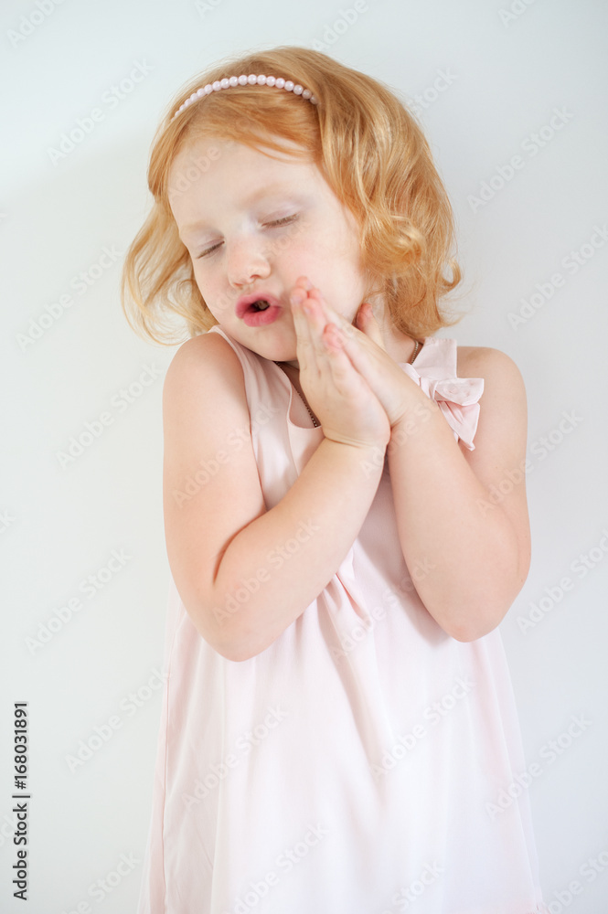 Red-haired girl singing on a white background Red-haired girl singing on a white background