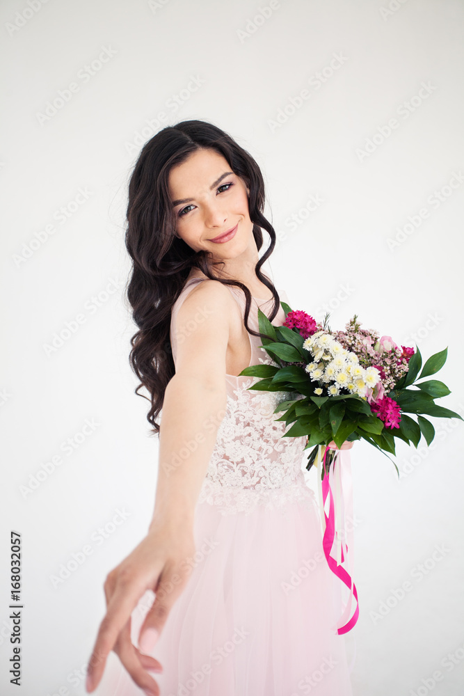 Beautiful Bride Woman with Colorful Flower Arrangement, Flower Wreath, Bridal Hairstyle and Makeup