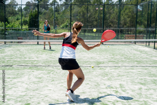 Two women playing padel outdoor