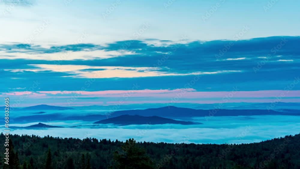 Mist over the tops of mountains and woods at breathtaking sunrise.4K time-lapse Mist over the tops of mountains and woods at breathtaking sunrise.4K time-lapse