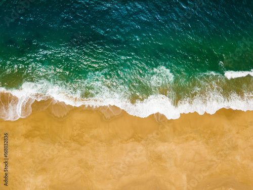 Top view of a deserted beach. The Portuguese coast of the Atlantic Ocean