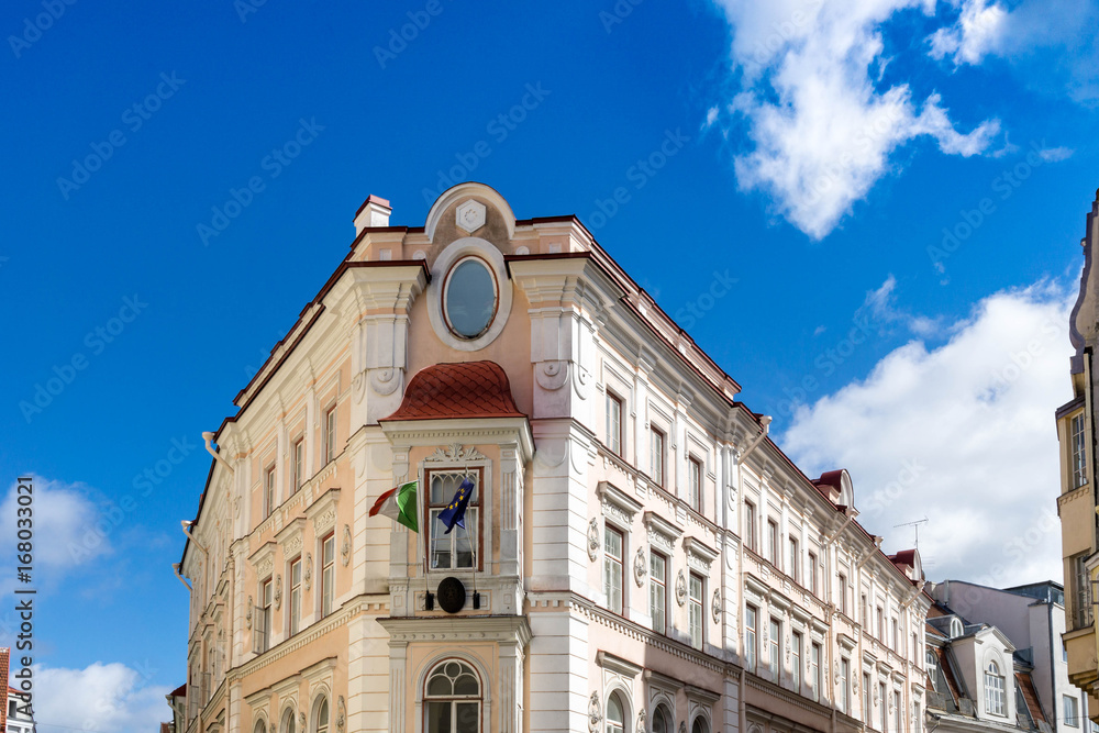 facade of an old building - blue sky with clouds