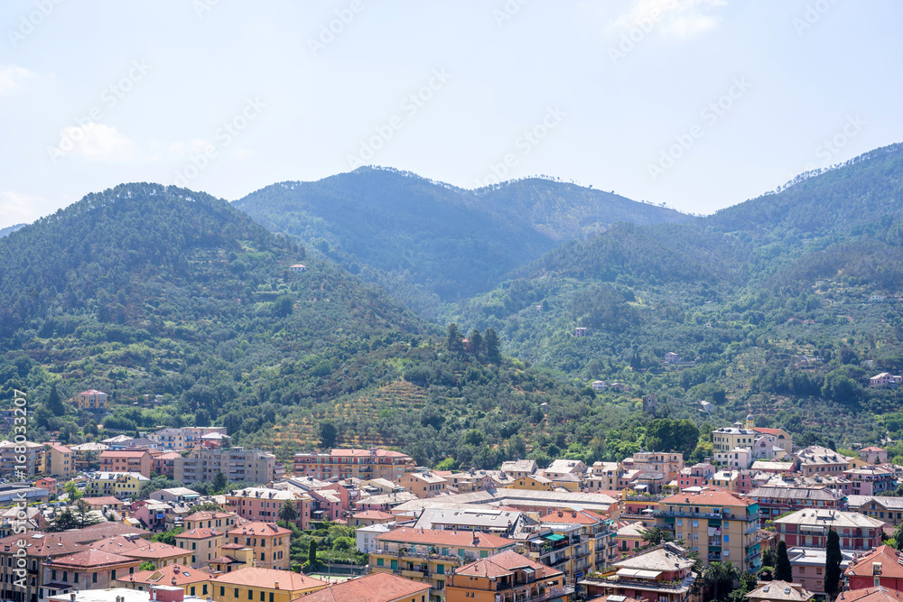 Beautiful daylight view to green mountains and buildings of Levanto, Italy. Cinque Terre beauties