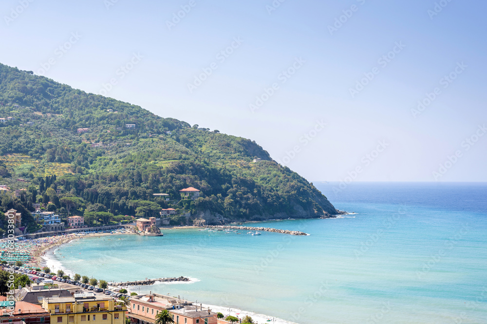 Beautiful daylight view to green mountains, blue sea and buildings of Levanto, Italy. Cinque Terre beauties